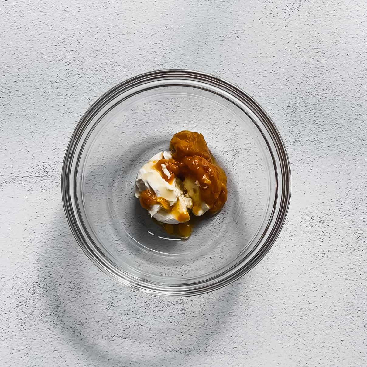 bowl of ingredients for The Best Easy Healthy Vegan Pumpkin Spice Cream Cheese