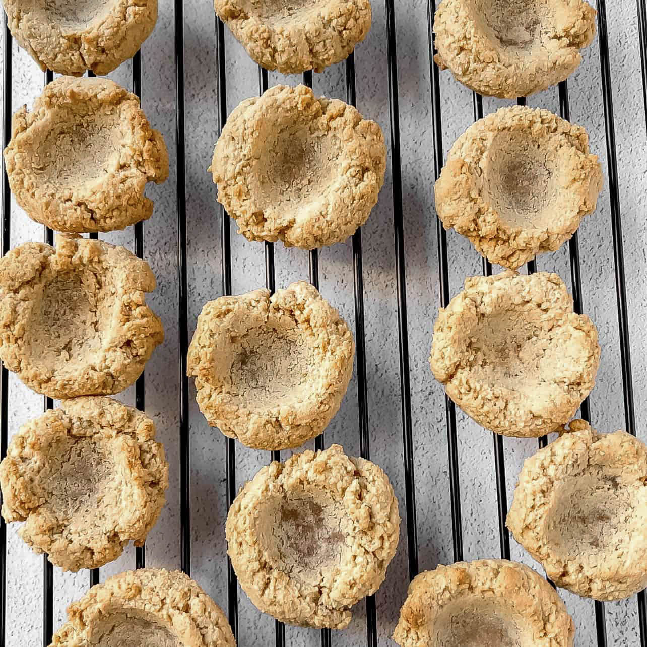 baked thumbprint cookies on cooling rack for Easy Vegan and Gluten-Free Thumbprint Cookies Filled with Apple Butter